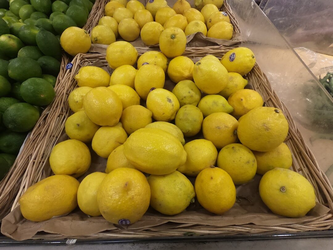 Wooden crates of fresh figs and lemons stacked at a Split market stall