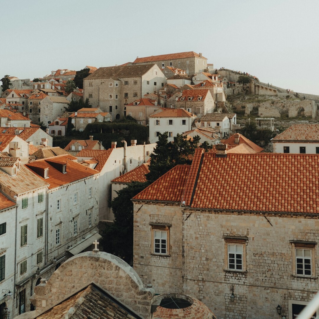 Stone entrance gate to Dubrovnik old town framed by ancient fortifications