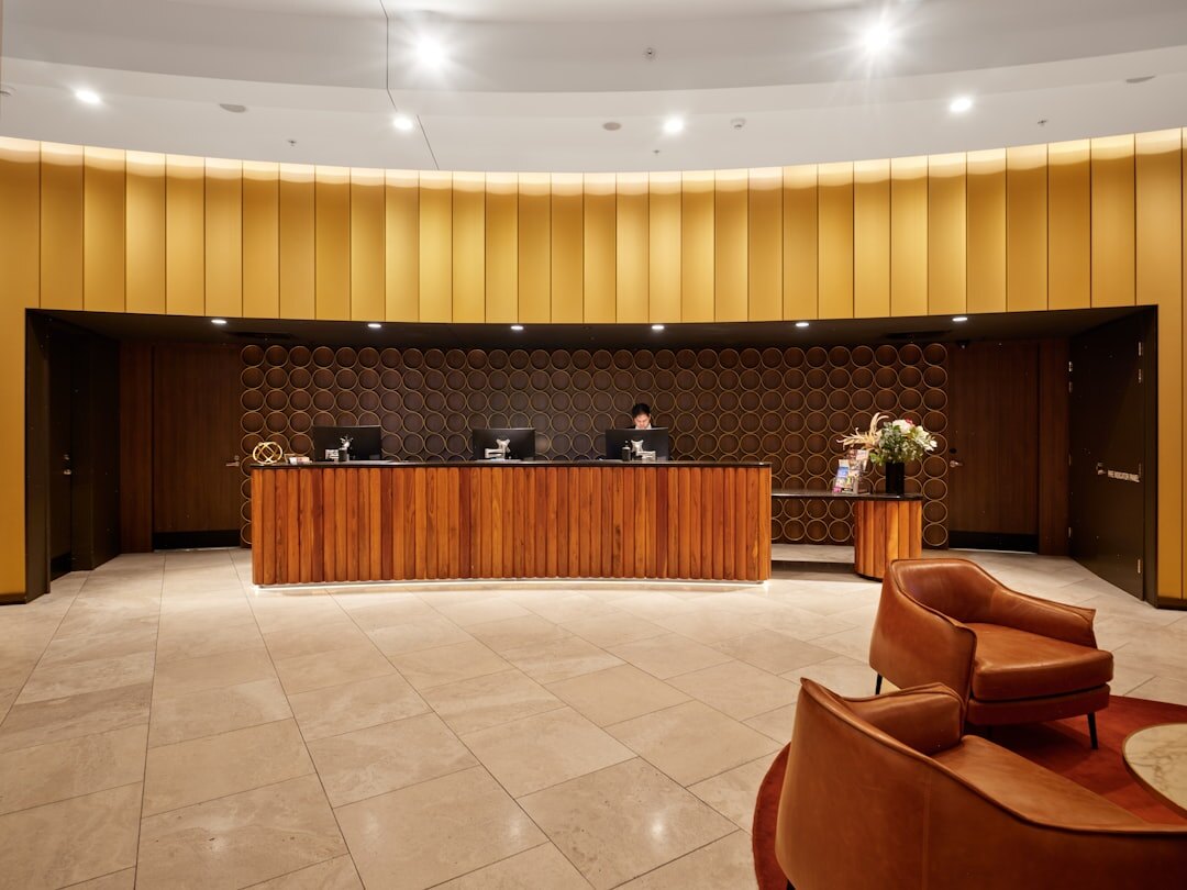 Elegant hotel reception desk with fresh flowers and warm lighting in a Dubrovnik boutique hotel